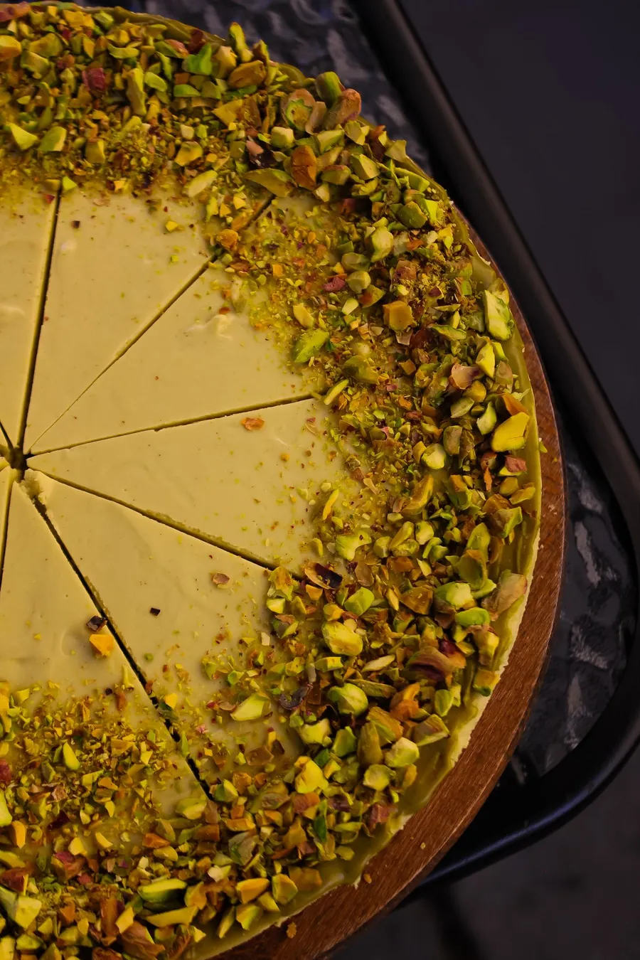 Pistachio cake topped with crushed pistachios